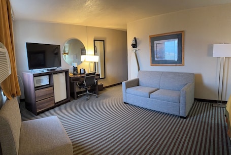 TV. Right off the Interstate, American style Restaurant/Bar Next door & Great Rates!