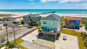 A coastal residential area with houses, a pier, and a beach. - Ocean Crystal A: 2nd-row duplex, ocean views, walk to beach/pier (Atlantic Beach)