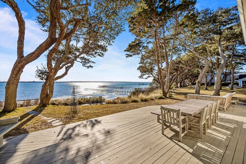 Three dog-friendly, waterfront cottages with full kitchens & private beach