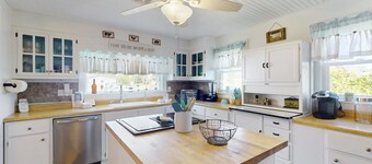 Dog-friendly coastal home with enclosed yard, gas grill and fire-pit