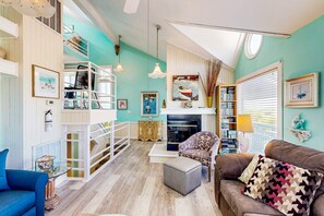 Televisión, chimenea, reproductor de DVD y videoteca 