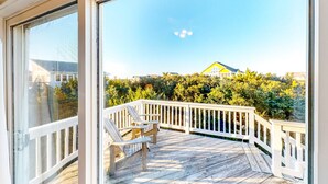 A wooden deck with white railings and two Adirondack chairs, overlooking a residential area with houses and greenery. - Spacious dog-friendly haven with private pool, hot tub, pool table, & AC (Avon)