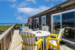 Outdoor dining - Oceanfront home with 2-tier deck, beach access & sunrise views - 2 dogs welcome (Frisco)