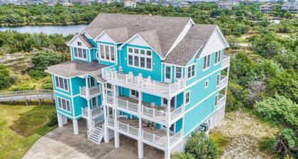 1-acre waterfront oasis with pool, hot tubs & sunrise/set views - dog-friendly