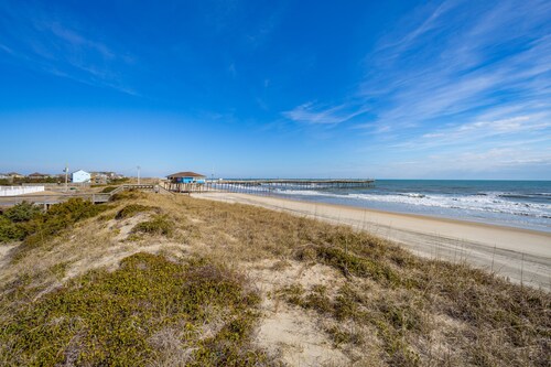 Fun-filled vacation home steps from beach with outdoor pool, AC, W/D, & balcony