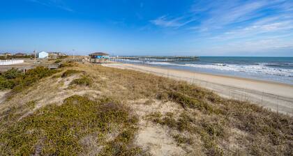 Fun-filled vacation home steps from beach with outdoor pool, AC, W/D, & balcony