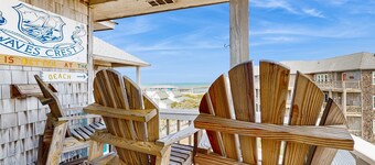 Fun-filled vacation home steps from beach with outdoor pool, AC, W/D, & balcony