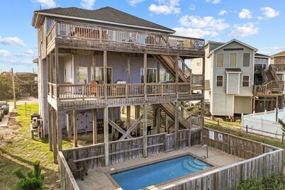 Coastal home with private pool, game room, media lounge, oceanside deck