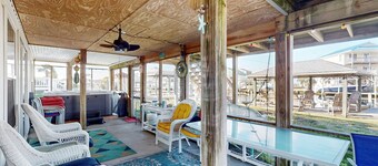 Dog-friendly waterfront home with screened-in patio, hot tub, grill, & W/D