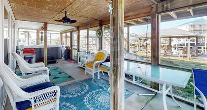 Dog-friendly waterfront home with screened-in patio, hot tub, grill, & W/D