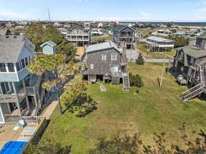 Exterior - Dog-friendly home steps from beach with yard, multiple decks, and arcade game (Waves)