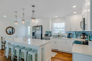 Fridge, microwave, oven, stovetop - Oceanfront home with beach access, a game room, washer/dryer, & central AC (Topsail Beach)