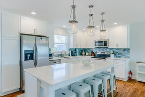 Fridge, microwave, oven, stovetop - Oceanfront home with beach access, a game room, washer/dryer, & central AC (Topsail Beach)