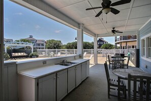 Outdoor dining - Waterfront home with ocean views, private pool, hot tub, & Tesla/EV charger (Frisco)