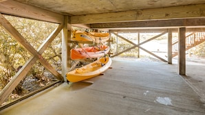 A covered wooden structure with kayaks stored underneath. - Waterfront, Dog-Friendly House w/Shared Pool, Free WiFi, Private W/D, Central AC (Frisco)