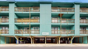 A multi-story building with a sign reading "WINDS".