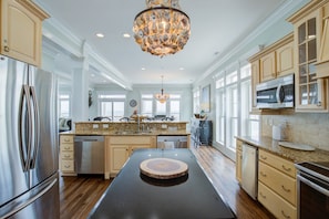 Fridge, microwave, oven, stovetop - 3-story beachfront home with ocean view, elevator, beach access, private hot tub (North Topsail Beach)