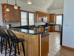 Fridge, microwave, oven, stovetop - Ocean-view home with central AC, pool, & hot tub (Buxton)