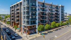 A multi-story residential building with balconies, located at a street corner. - The Nash Luxe- In the heart of Nashville (Nashville)