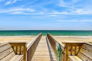 A wooden boardwalk leading to a beach with a clear view of the ocean. - Oceanfront Retreat with Direct Beach Access & Beautiful Coastal Views (North Topsail Beach)