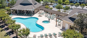 Golf community condo near beach with on-site pool, golf, & screened balcony