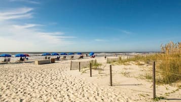 On the beach, sun loungers, beach towels