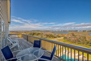 Outdoor dining - Dog-friendly sound- & beach-view home with private heated pool, decks, AC & W/D (North Topsail Beach)
