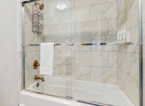 Shower, towels - Oceanfront duplex with beach access, 2 primary suites, hot tub, & kitchen (Holden Beach)