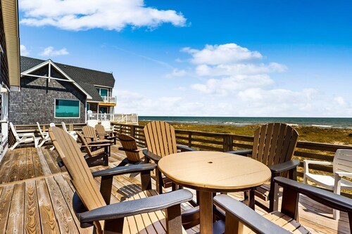 Three-story beachfront home with private pool, hot tub, decks, & ocean views