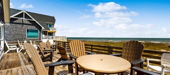 Three-story beachfront home with private pool, hot tub, decks, & ocean views