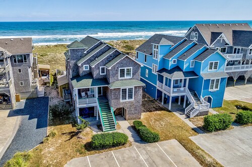 Three-story beachfront home with private pool, hot tub, decks, & ocean views