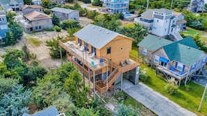 A residential area with houses, including a two-story house with a deck and a large house with a balcony. - Spacious dog-friendly house with shared pool, private hot tub, & central AC (Avon)