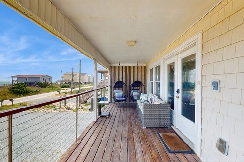 Updated home steps away from the beach with Outside Patio, Central A/C, and Wifi