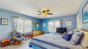 A bedroom with a bed, a ceiling fan, a television, and a dresser. - HB93 Holden Friends - 2nd row, 3 bedroom, NEW private pool (Holden Beach)