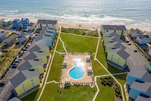 Exterior - Oceanfront condo with beach views, balcony, community pool & W/D, central AC (Surf City)