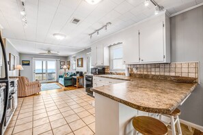 Fridge, microwave, oven, stovetop - Beachfront home with WiFi, patio, central AC & private washer/dryer (Holden Beach)