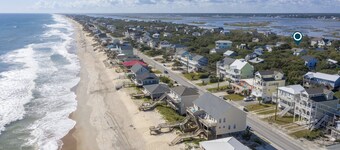 Dog-friendly coastal home with wrap-around porch and short walk to the beach