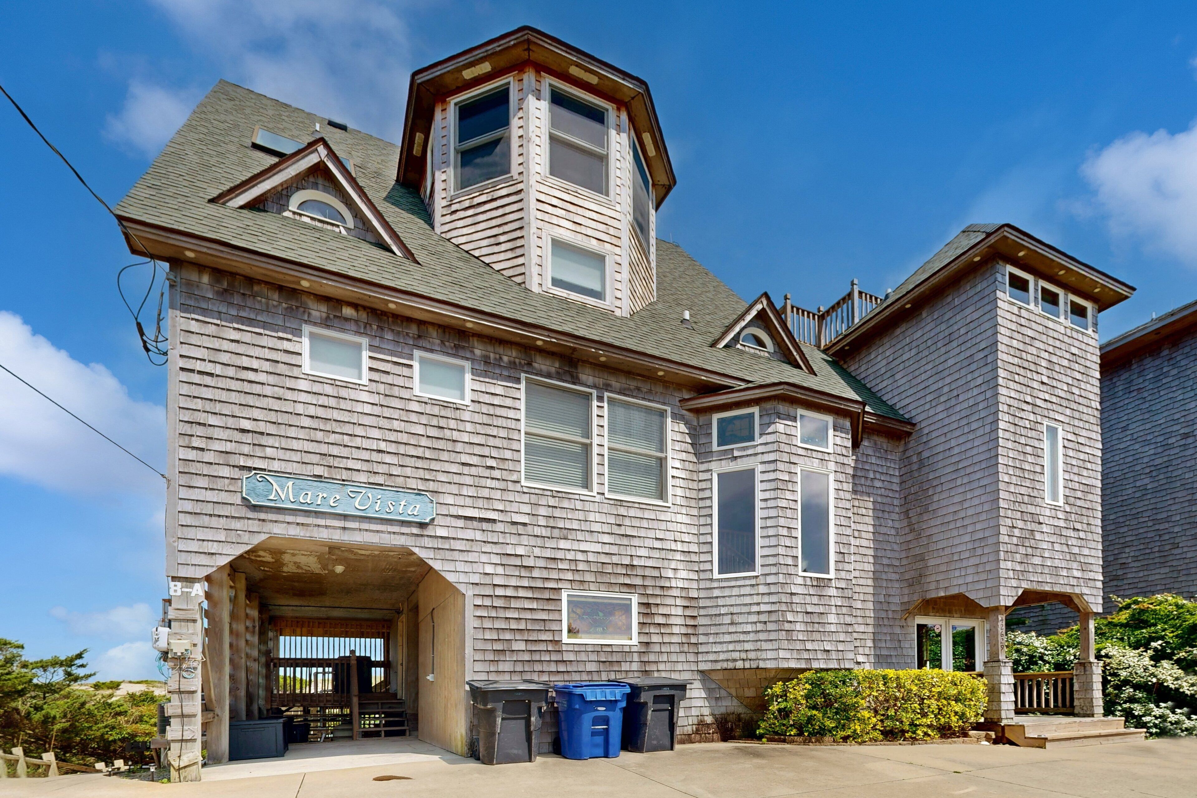 A two-story building with a sign reading "Mare Vista."