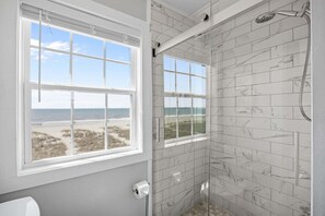 Shower, towels - Oceanfront oasis on the beach with boardwalk, deck, outdoor shower, & central AC (Holden Beach)