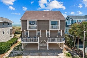 Exterior - Spacious oceanfront duplex with two kitchens, large deck, WiFi, & AC - dogs OK (Holden Beach)