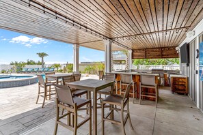 Outdoor dining - Modern Oceanfront Home with Zero-Entry Pool, Hot Tub, Outdoor Kitchen, WiFi & AC (Holden Beach)