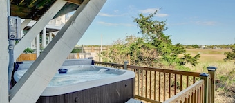 Dog-friendly home with NEW FLOORING THROUGHOUT, decks, & private hot tub