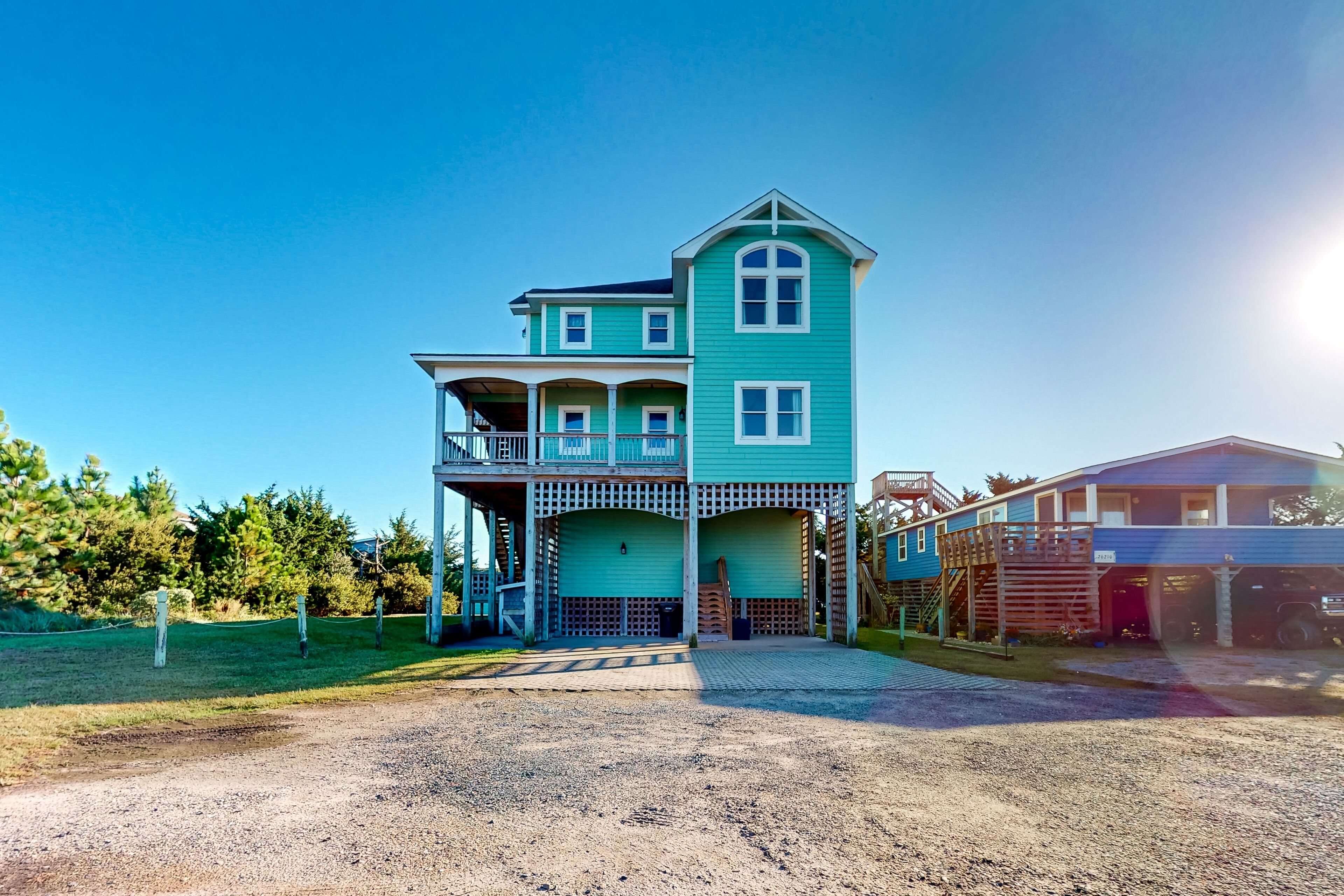 A two-story house with a porch and a garage.