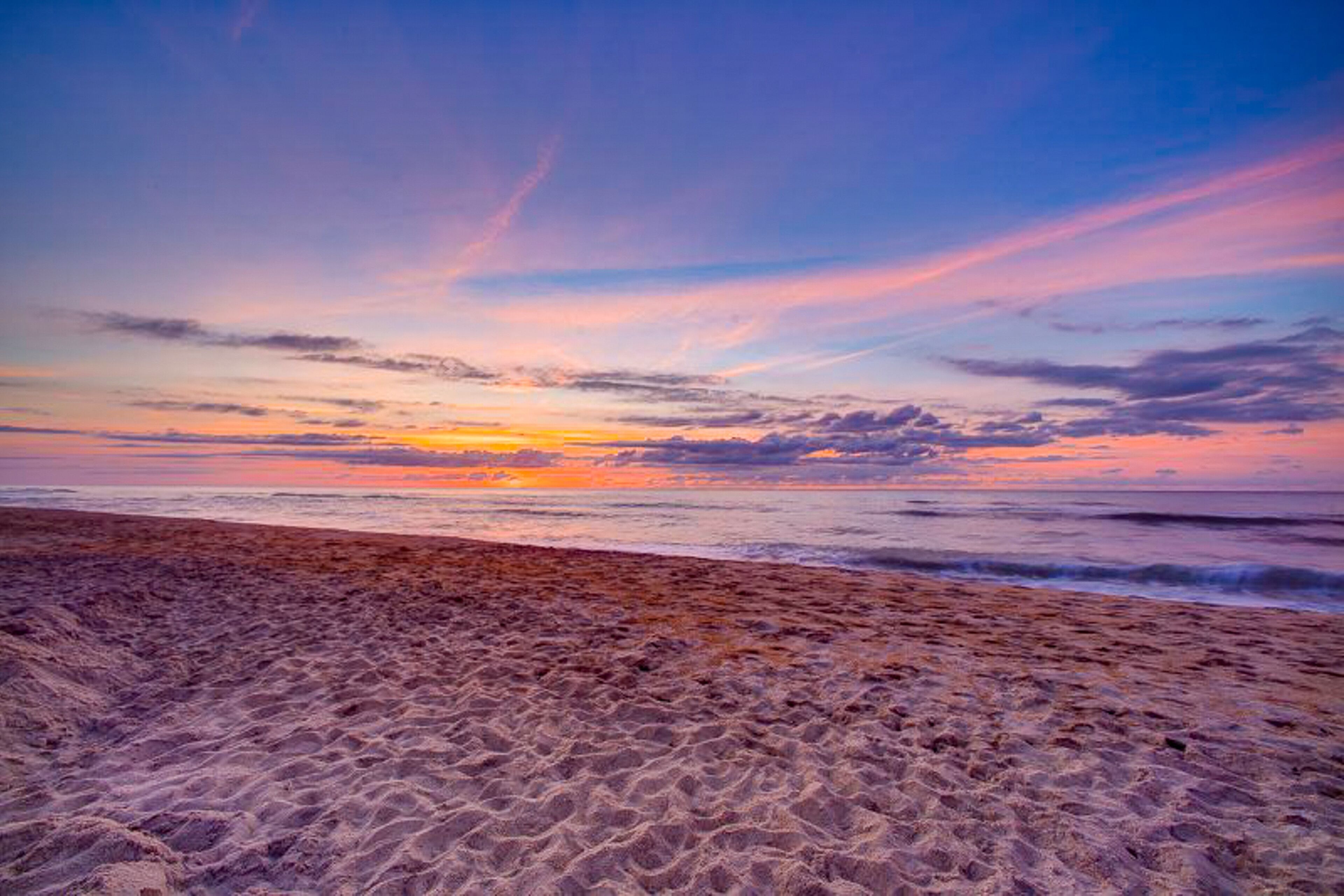 A beach with a sunset view.