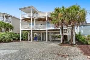 Exterior - Sprawling home with pool access, balconies, enclosed yard, & grill - dogs ok (Ocean Isle Beach)