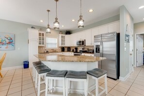 Fridge, microwave, oven, stovetop - Sprawling home with pool access, balconies, enclosed yard, & grill - dogs ok (Ocean Isle Beach)