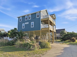 A two-story building with a balcony on the upper floor.
