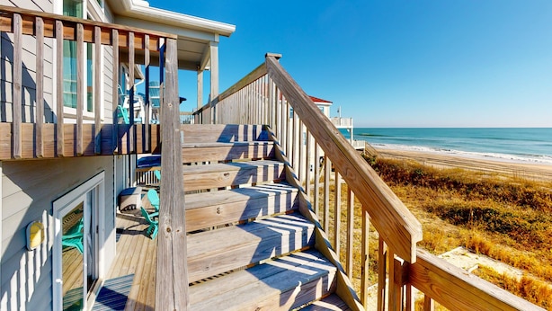 A wooden staircase leading to a balcony with a view of the beach. - Beautiful dog-friendly ocean view home with hot tub, lovely balcony, W/D & AC (North Topsail Beach)