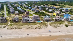 An aerial view of a coastal residential area with houses, a beach, and a small body of water. - Beach home near the ocean w/sunny deck, washer/dryer, and central A/C (Frisco)