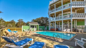A pool area with lounge chairs, a small pool, and a multi-level building with balconies. - Dog-friendly ocean- & sound-view home with private pool, hot tub, & central AC (Avon)